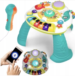 Mesa musical educativa con piano, trompeta y micrófono