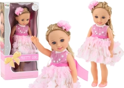 Muñeca con vestido rosa, pelo largo y cepillo 38 cm