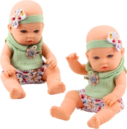 Muñeca bebé con conjunto verde con estampado floral y diadema con lazo