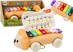 Xilófono infantil con forma de león con ruedas: instrumento educativo de colores