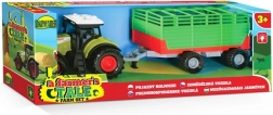 Tractor con remolque de heno a pilas
