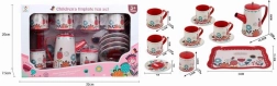 Juego de té metálico con diseño floral
