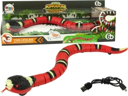 Serpiente interactiva controlada por tacto roja con rayas negras