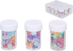 Cuentas de plástico de colores en tubo