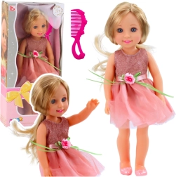 Muñeca con vestido rosa, lazo y peine