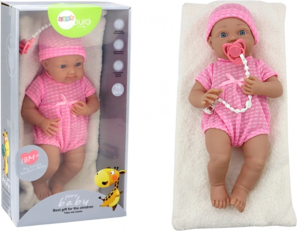 Muñeca bebé con ropa rosa, gorrito, chupete y mantita
