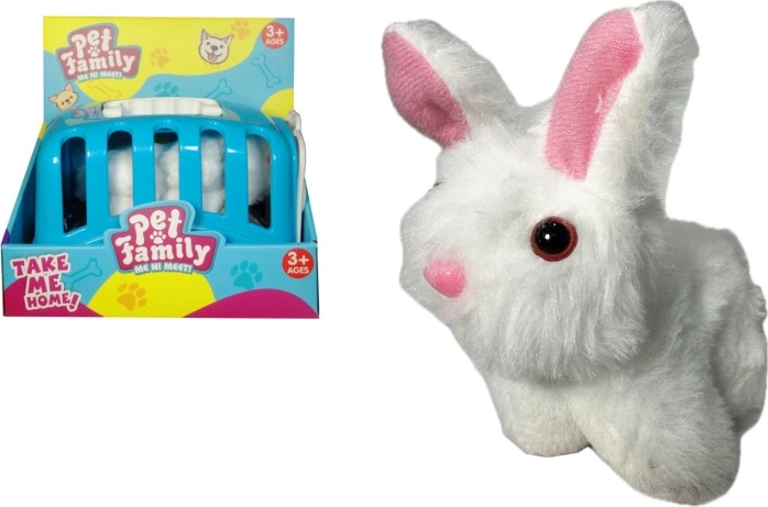 Conejito de peluche con accesorios en transportín