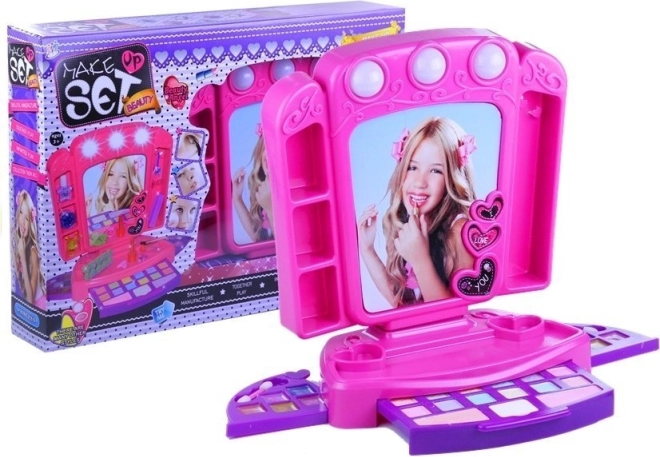Tocador infantil rosa con cosméticos y luces
