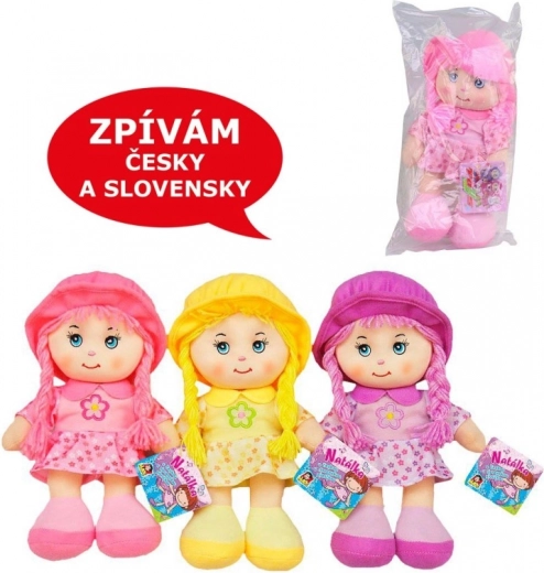 Muñeca textil con sonido 26 cm