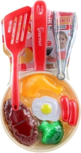 Set de cocina infantil con sartén y alimentos
