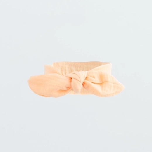 Diadema infantil de muselina New Baby Leny Peach 12–18 meses