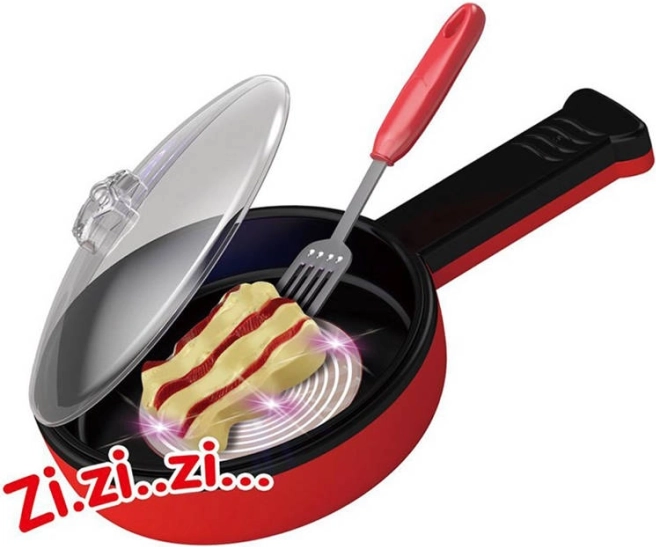 Set de cocina mágico con sartén y efecto de fritura
