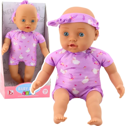 Muñeca bebé de tela con body morado y diadema con lazo 31 cm