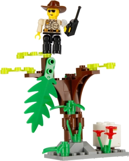 Escena de jungla con árbol y flores