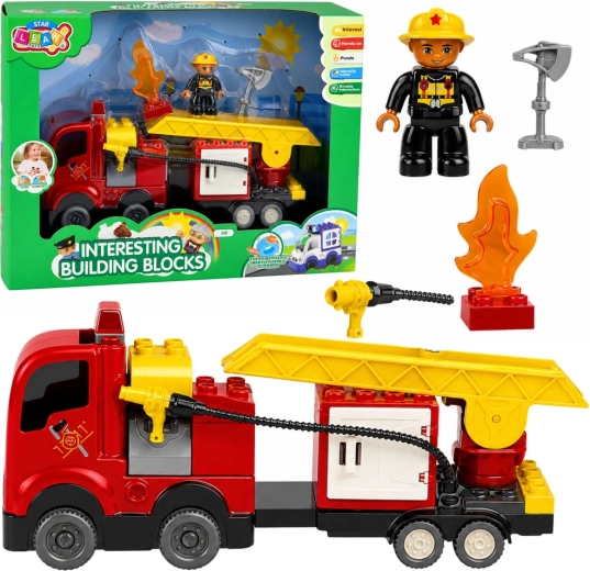 Set de construcción: coche de bomberos con propulsión por fricción, escalera y figura de bombero