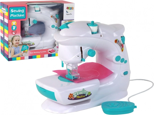 Máquina de coser infantil como de verdad, blanca, a pilas