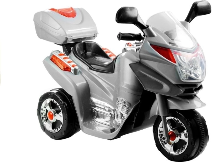 Moto eléctrica infantil de tres ruedas plateada
