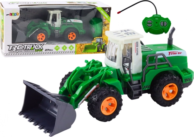 Cargadora verde teledirigida con brazo móvil