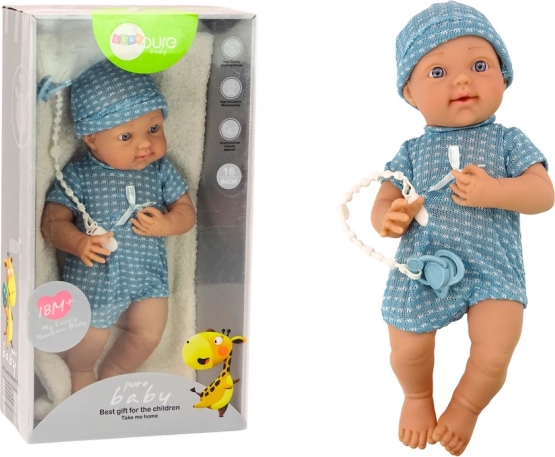 Muñeca bebé con ropa azul, gorrito y chupete