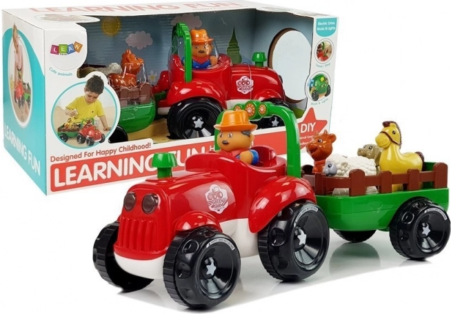 Tractor musical con remolque y animales a pilas