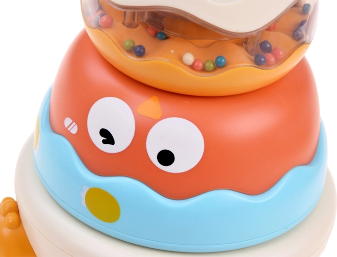Sonajero transparente con bolitas de colores