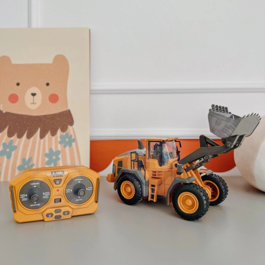 Cuchara móvil para juegos de construcción