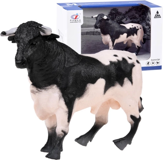 Figura de toro blanco y negro de granja