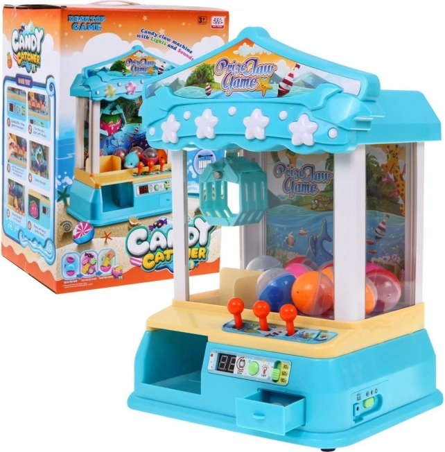 Máquina recreativa infantil con garra 3+ – juego de mesa con bolitas, panel de control y fichas