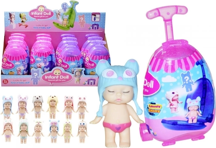 Muñeca en maleta con accesorios