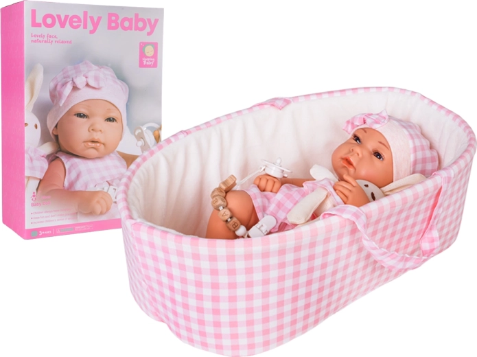 Muñeca bebé en portabebés rosa