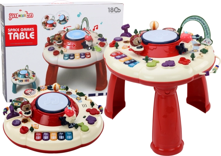 Mesa educativa interactiva con piano y tambor, roja