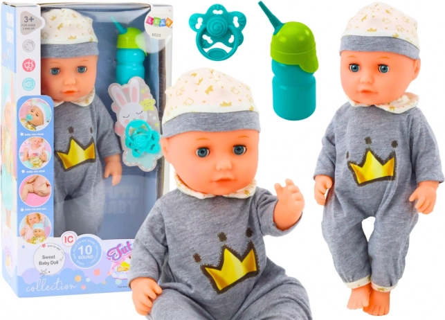 Muñeca interactiva bebé con pijama gris