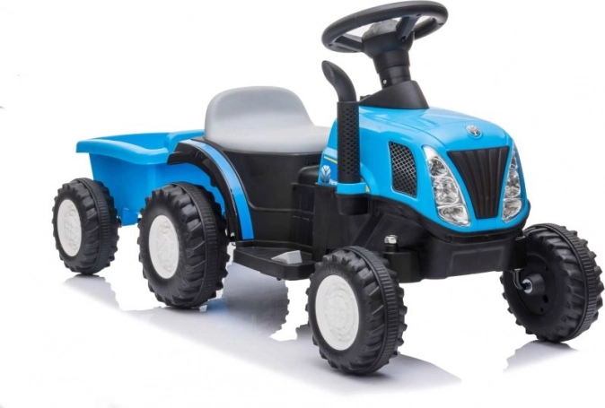 Tractor infantil azul a batería con remolque
