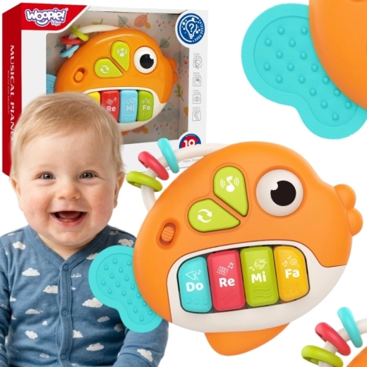 Woopie baby pez interactivo con piano con sonidos y luz 18m+