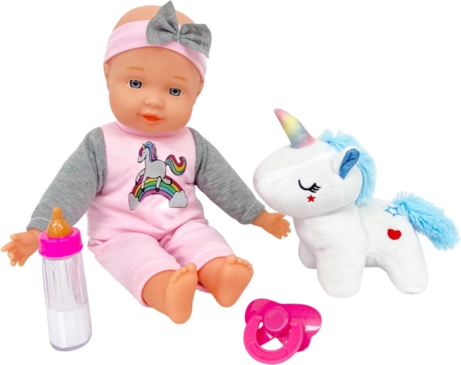 Bebé con unicornio de peluche de 30 cm