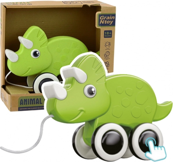 Dinosaurio verde de arrastre con silbato