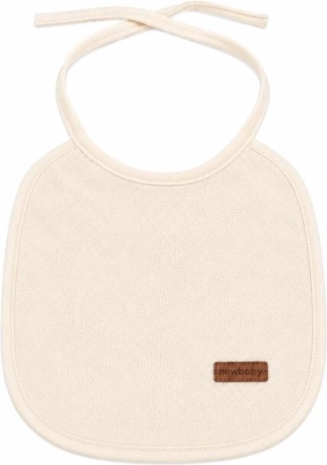 Babero infantil de rizo New Baby con forro de PVC beige - 1 pieza
