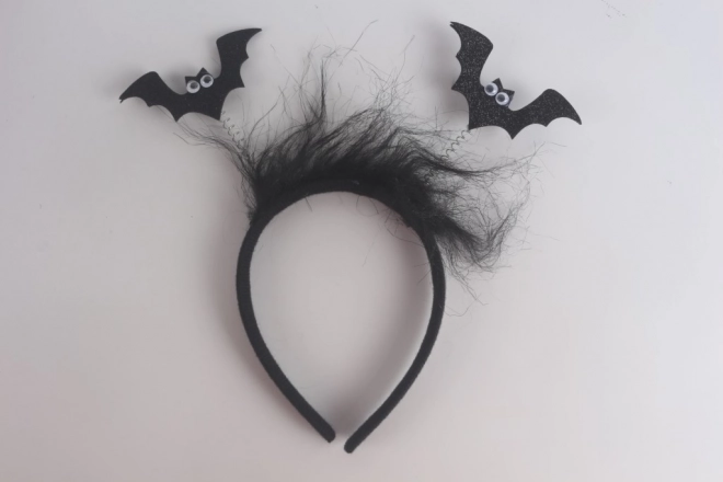 Diadema con murciélagos y plumas