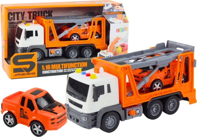 Camión grúa multifuncional con coche 1:16, luces y sonidos, naranja