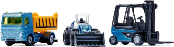 Tres máquinas de construcción en un solo set