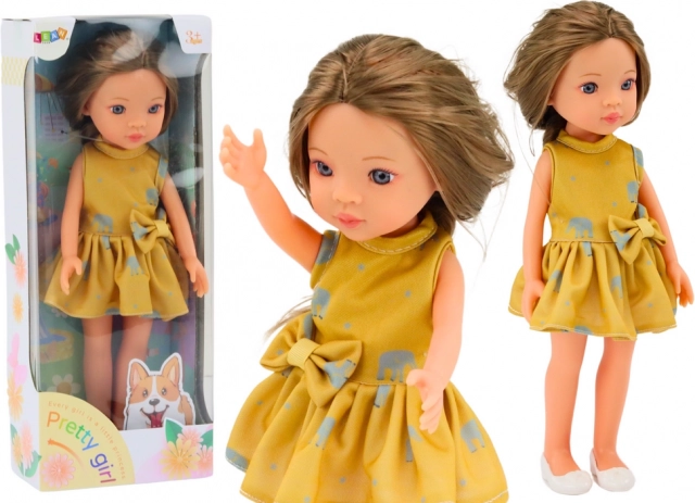Muñeca con vestido amarillo y cabello castaño 33 cm