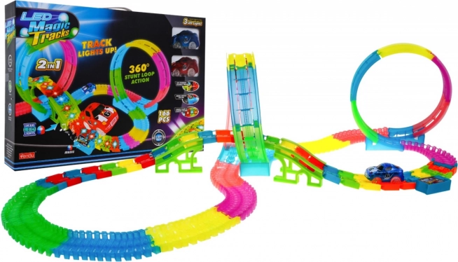 Pista de carreras luminosa para niños 3+ con coches LED, loops 360°, peraltes, 166 piezas