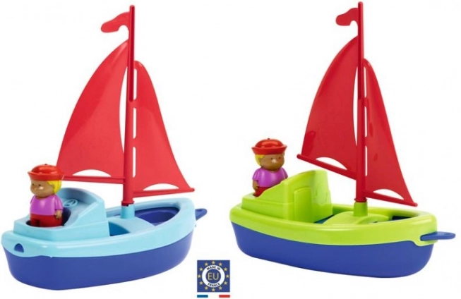 Velero de plástico para el agua con marinero, 22,5 cm