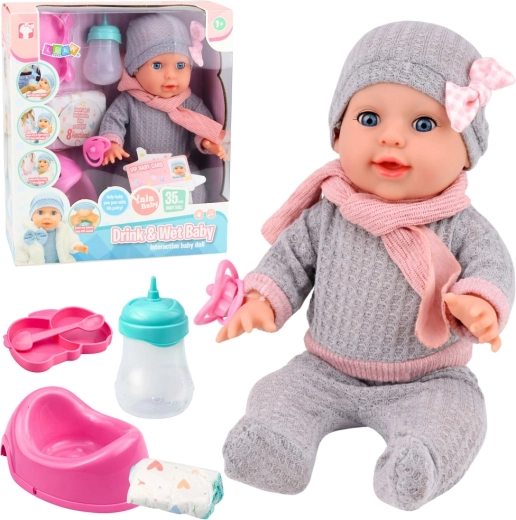 Muñeca interactiva que hace pipí de 35 cm con accesorios: biberón y orinal