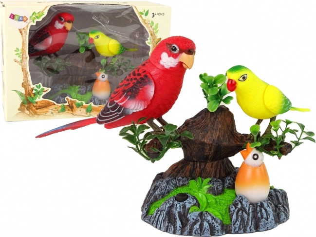 Loros cantores móviles en un árbol de colores