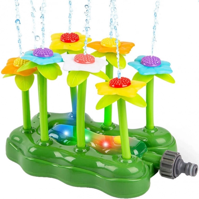 Aspersor de jardín con flores iluminadas – fuente de agua para niños
