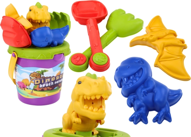 Set de arena con moldes de dinosaurios: cubo, pala y rastrillo