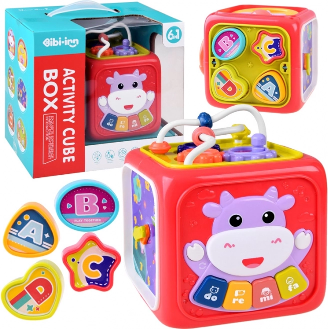 Cubo educativo interactivo con piano, laberinto y clasificador