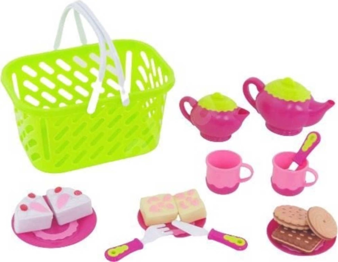 Servicio de té infantil con alimentos en una cesta de la compra
