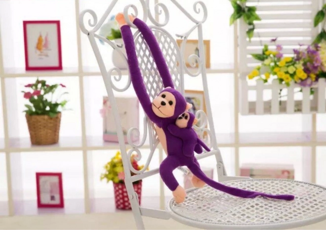 Monito de peluche morado con cría